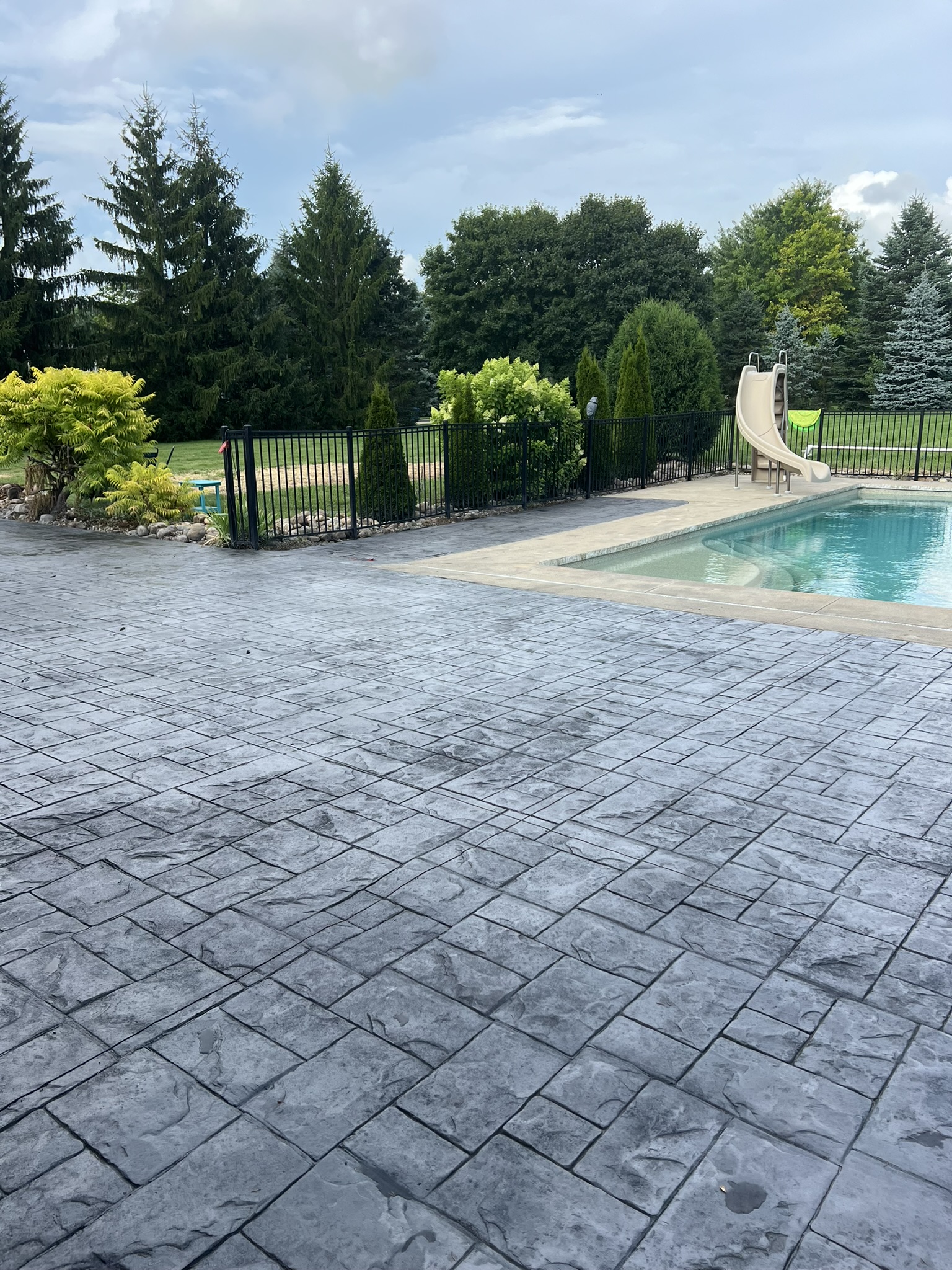 stamped-concrete-for-pool-area, black pearl, stamped concrete, concrete company novi mi, stamped concrete contractor, stamped concrete in novi, stamped concrete contractors in novi